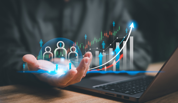 Customer relationship management and business growth concept, Businessman use a laptop and show marketing graph analyzing stock market changes with customer relationship management 