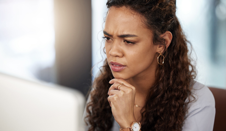 Doubt, confused or woman thinking on computer solution, research or serious job decision or planning. Reading, reviewing business ideas or frustrated analyst for problem solving on digital technology.