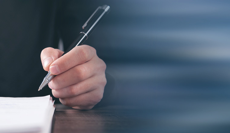 Male Judge signing in document. Justice and Law concept