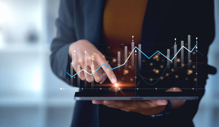 Business people analyzing data graphs and charts displayed on the digital tablet screen. Business analytics and financial technology. Technology stocks and future investments.