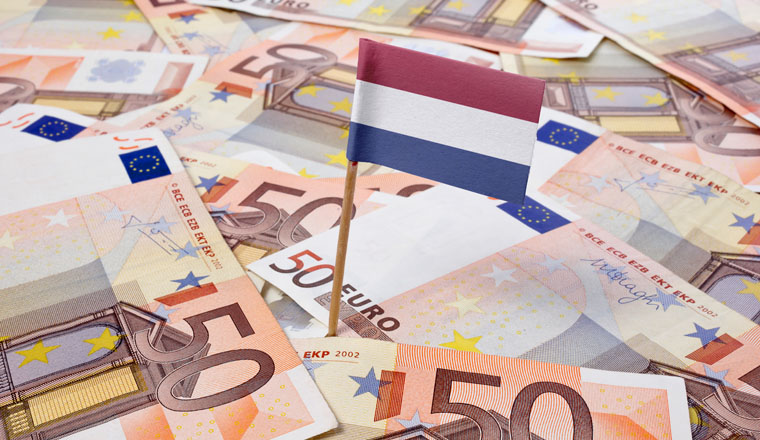 Flag of Netherlands sticking in european banknotes.(series)