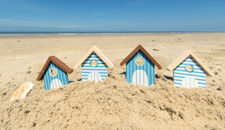 Summer beach with landscape and wooden huts