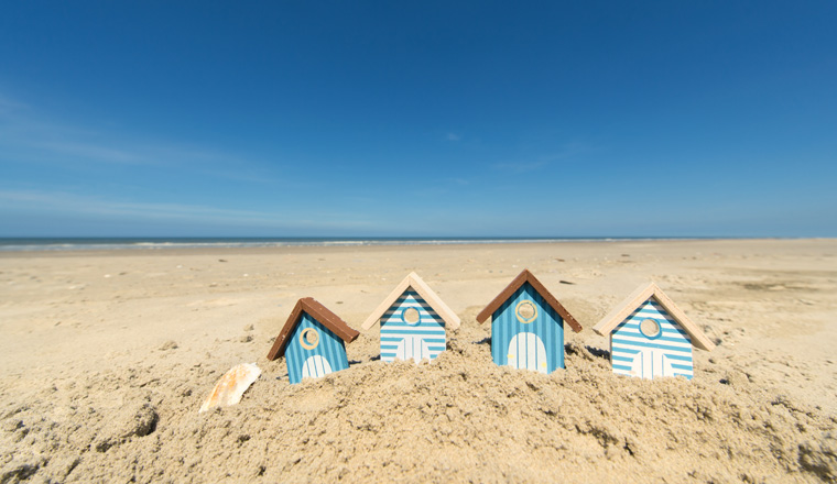 Summer beach with landscape and wooden huts