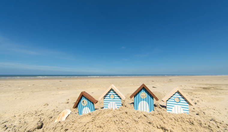 Summer beach with landscape and wooden huts