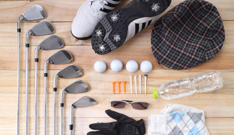 Golf equipment on wood floor preparing for good game 