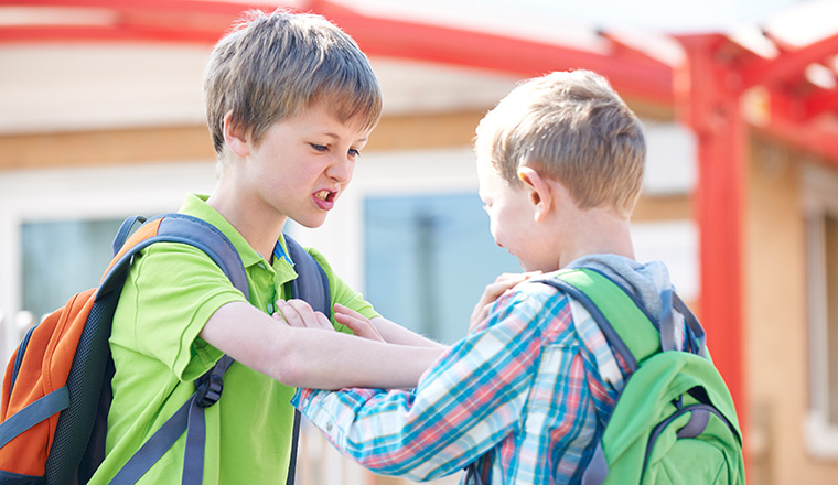 Two Boys Fighting In School Playground