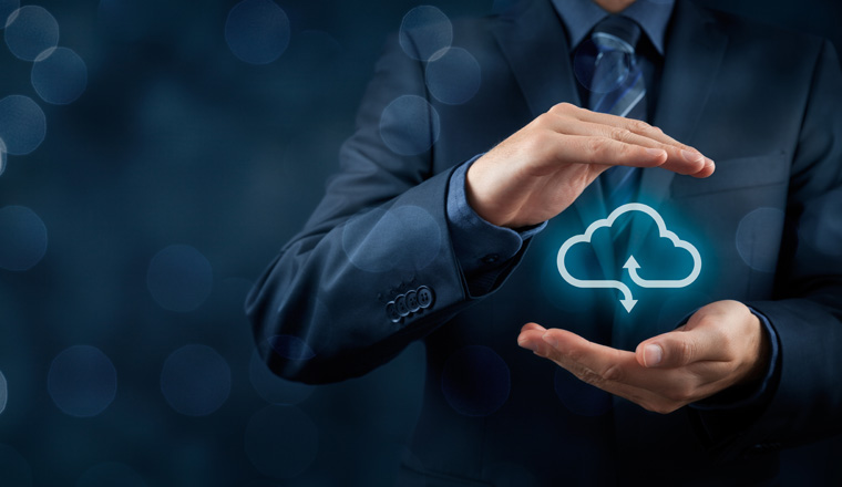 Cloud computing service concept - connect to cloud. Businessman offering cloud computing service represented by icon. Wide banner composition and bokeh in background.
