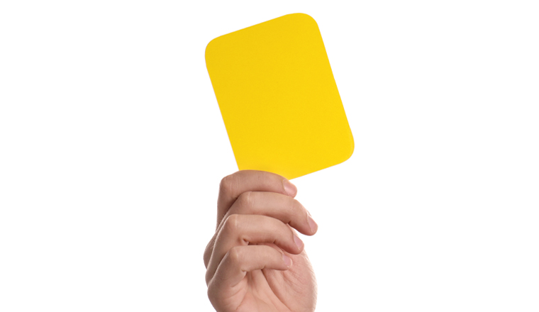 Man holding yellow card on white background, closeup of hand