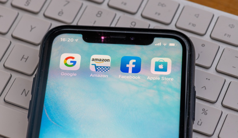 Paris, France - February, 20, 2020 : Mobile phone displaying the Gafa site  : GAFA apps and icons on an iPhone. Google, Amazon, Facebook and Apple are the four US multinational IT or online service companies that dominated cyberspace .