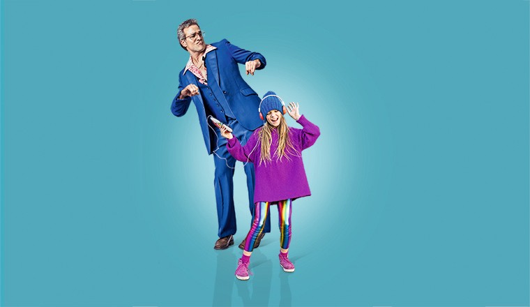 Studio shot of a mature man in a retro suit doing some old school dance moves