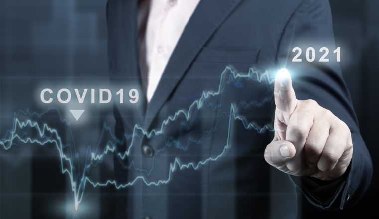 concept of economic recovery after the fall due to the covid 19 coronavirus pandemic. Double exposure of financial graph. Businessman pointing graph corporate future growth plan on dark blue