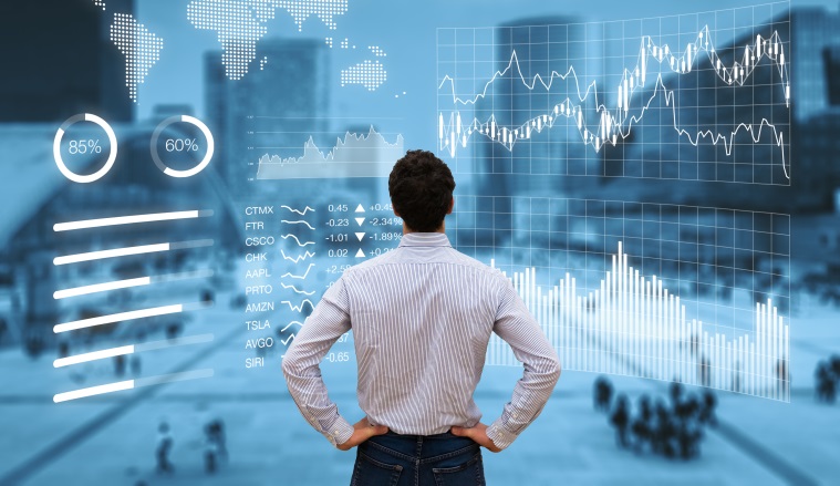 Person analyzing a financial dashboard with key performance indicators (KPI) and business intelligence (BI) charts with a business district cityscape in background