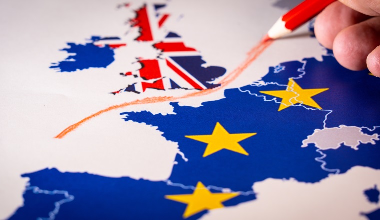 Hand drawing a red line between the UK and the rest of the European Union. Concept of Brexit. The UK is thus on course to leave the EU on 29 March 2019