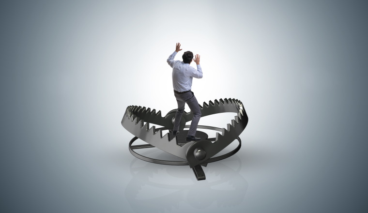 Man caught in mouse trap in risk business concept