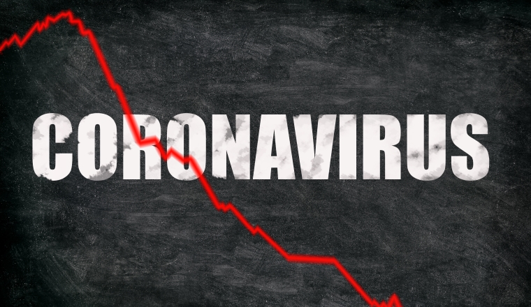 Coronavirus stock market crashing. Corona virus crash causing new financial crisis and bear market recession and economic downturn. Negative graph of stocks on black blackboard billboard.
