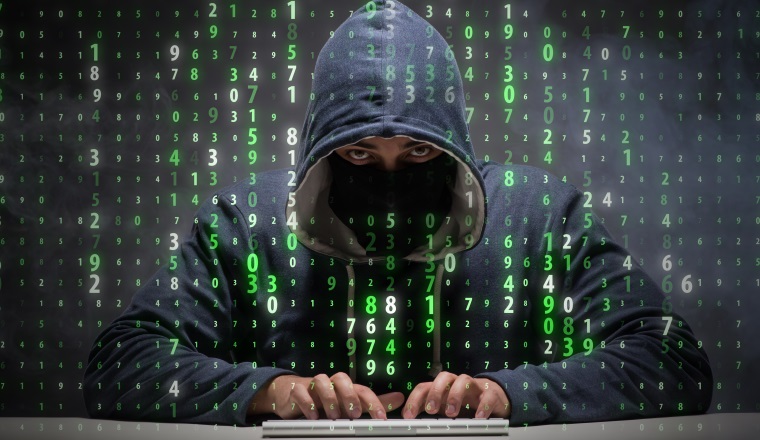 Young hacker in data security concept