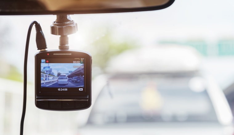 Recorder camera in front of car for safety on the road.