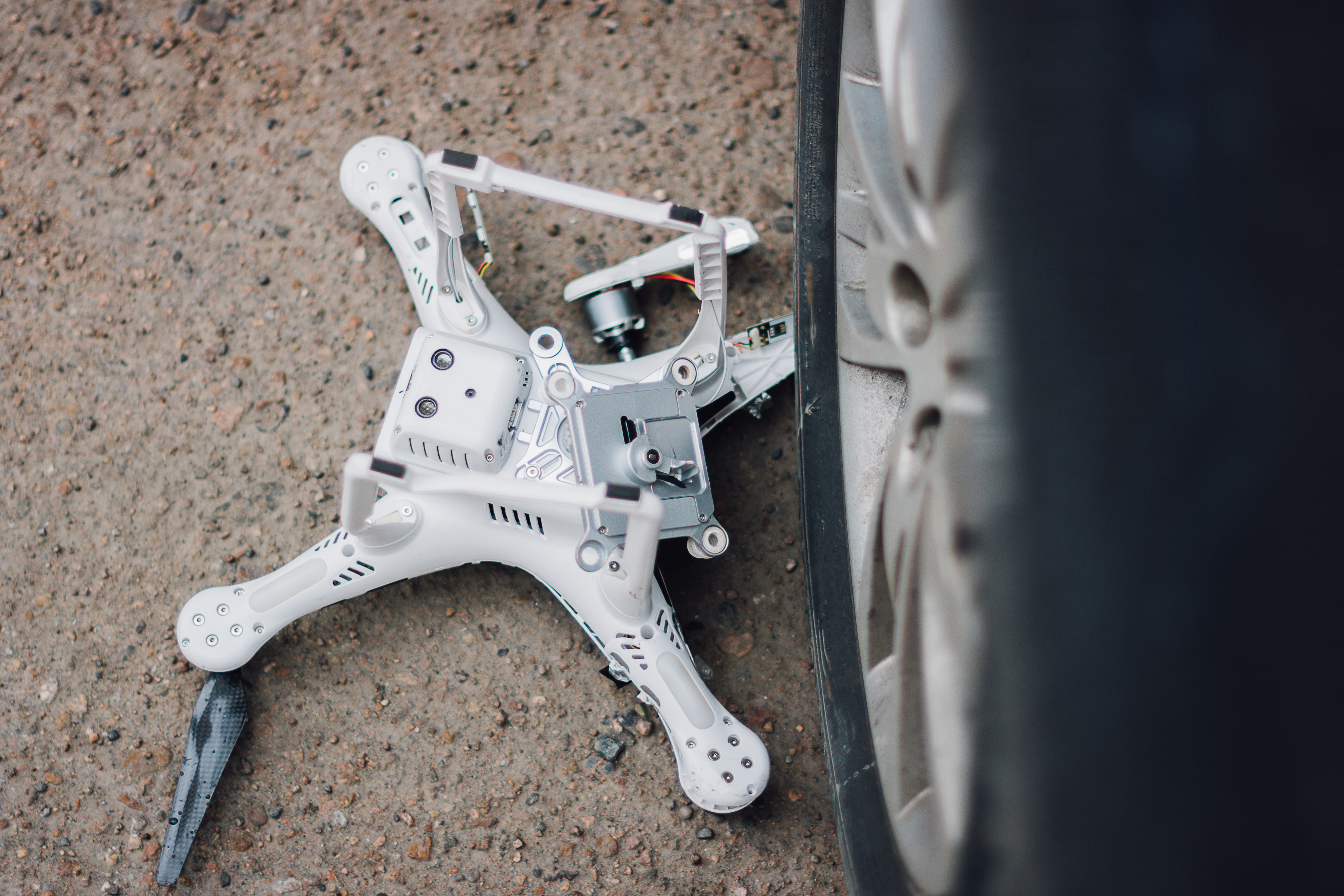Crashed quadcopter after an accident laying on the ground