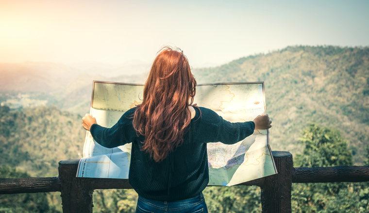 Travelers explore the mountainous forest map.