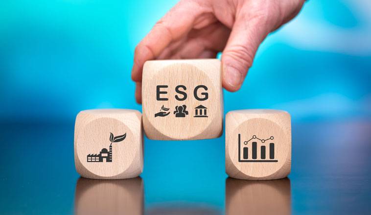 Wooden blocks with symbol of esg concept on blue background