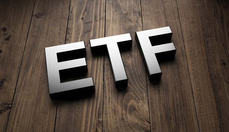 Metallic 3d ETF sign lying obliquely on wooden boards for an interesting header for Exchange Traded Funds with copy space