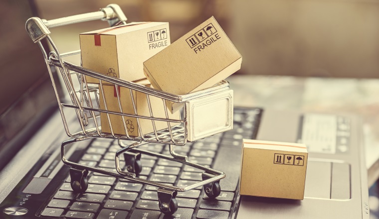 Paper boxes in a shopping cart.