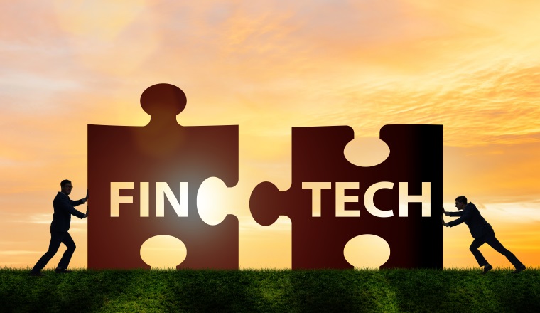 Fintech financial technology concept with puzzle pieces