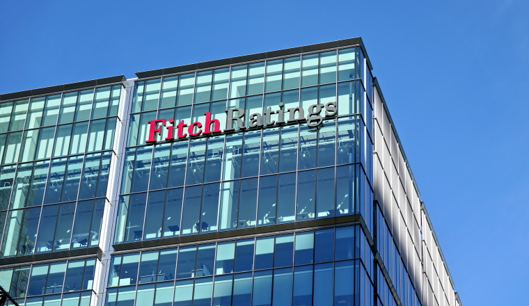 London, United Kingdom - February 03, 2019: Fitch Ratings logo signage at top of their Headquarters in UK (other is in New York), Canary Wharf. FR is one of the Big Three credit rating agencies