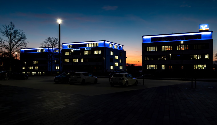 WETZLAR, GERMANY-2020-08-27: Volksbank Mittelhessen eG Buildings at Night. Volksbank Mittelhessen is a cooperative bank. In Germany, cooperative banks are usually banks in the legal form of a registered cooperative.