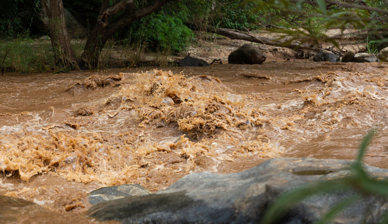 Natural disaster,powerful water currents and rapids churning in flowing stream river,dangerous flash flood of waterfall in nature,the major cause heavy flooding,including the impact of deforestation,no trees slow the water in rainy season