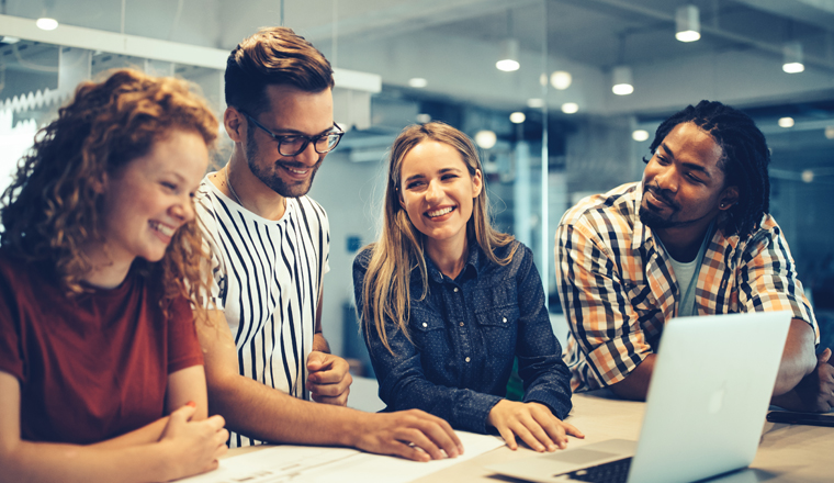 Group of business people, designers and software developers working as a team in office