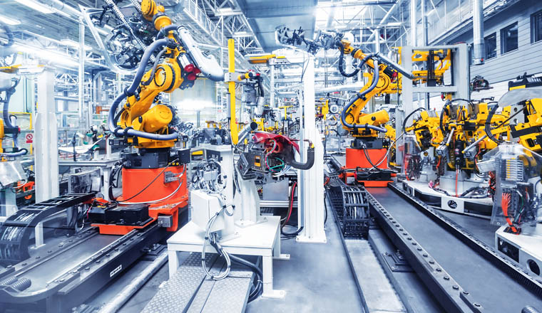 robotic arms in a car plant