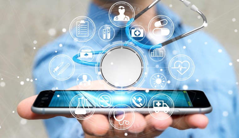 Businessman on blurred background holding and touching floating stethoscope 3D rendering