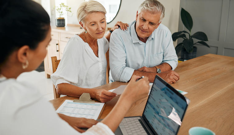 Financial advisor consultation with clients on retirement, finance planning or investment and document on laptop screen. Accountant woman, senior people and pension advice, asset management or budget.