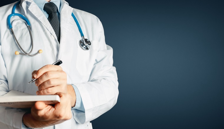 Healthcare And Medicine. Doctor Writes Data Into Medical History