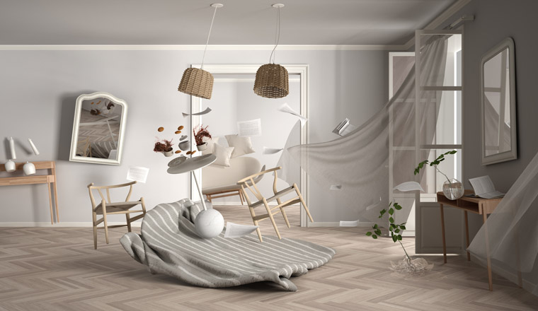 Living room, home chaos concept with chairs and table, carpet, windows and curtains, broken vase, mirrors, furniture and other accessories flying in the air, explosion, gust of wind