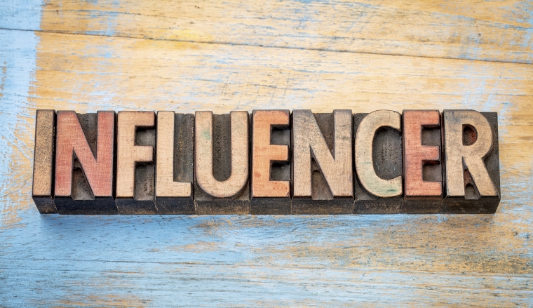 influencer - word abstract in vintage letterpress wood type printing blocks