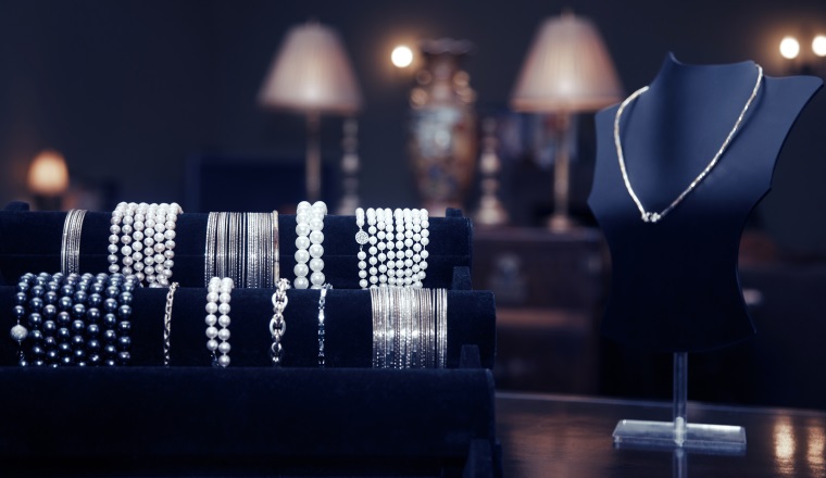 Assortment of jewelry in a jewelry shop. Close-up view