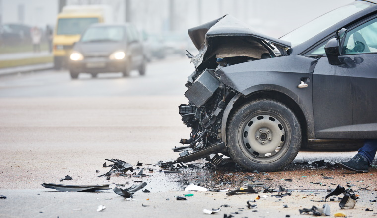 car crash accident on street, damaged automobiles after collision in city