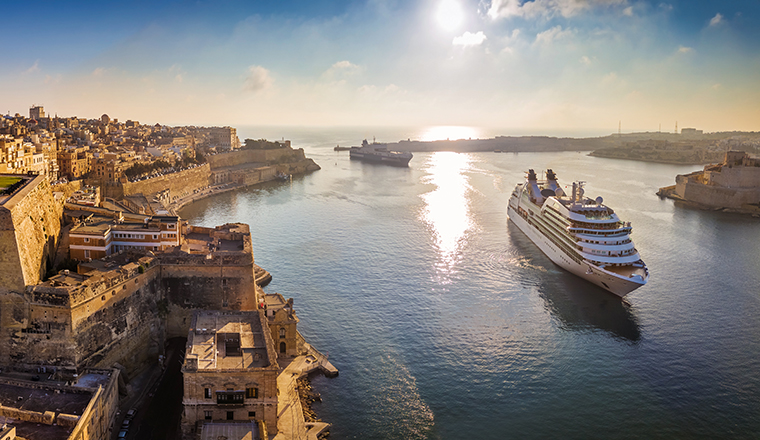Valletta, Malta - Panoramic aerial skyline view of Valletta when cruise ships sailing in the Grand harbor at surnise