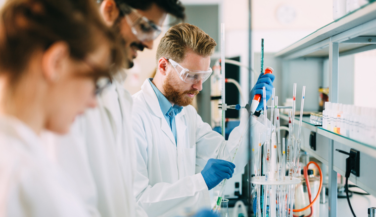 Group of chemistry students working together in laboratory