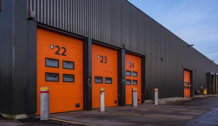 Red aluminum doors to  a black cargo building, Frederikssund, Denmark, January 2, 2018