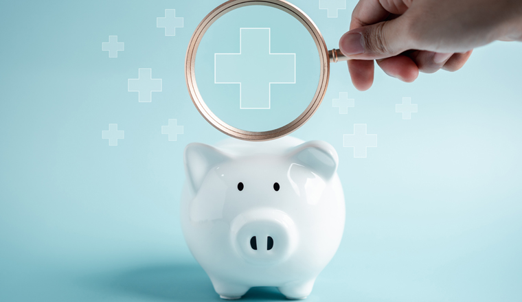 Piggy bank money health check concept. Health care financial checkup and saving for medical insurance cost planning in the future.