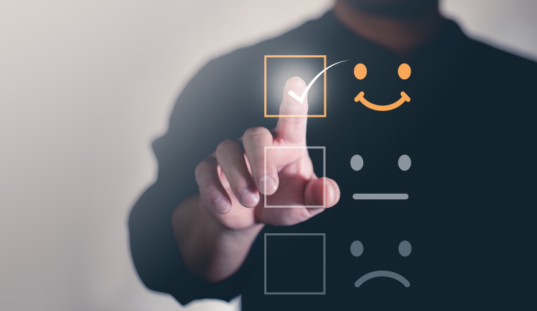 Customer service and Satisfaction concept  ,Business people are touching the virtual screen on the happy Smiley face icon to give satisfaction in service. rating very impressed.