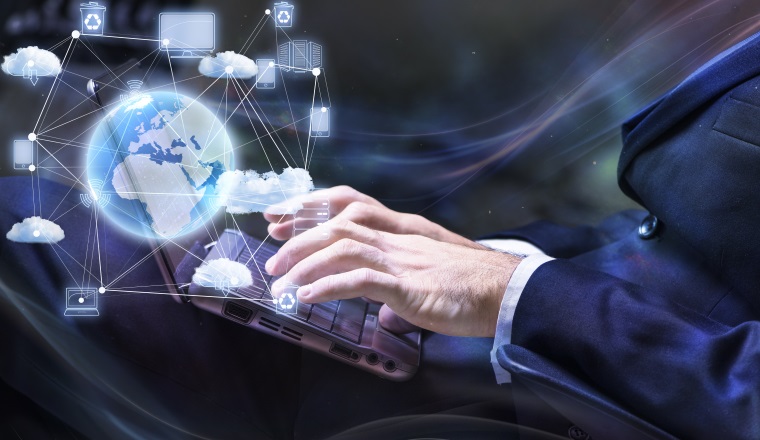 Businessman working with laptop in cloud computing concept