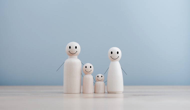 wooden doll family happy face, family home, adoption foster care, homeless support , family mental health, domestic violence, social distancing