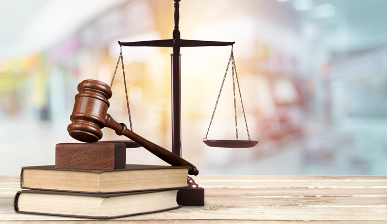 Justice Scales and books and wooden gavel on table. Justice concept