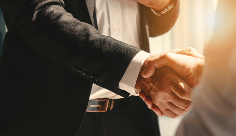 business background of businessman having handshake