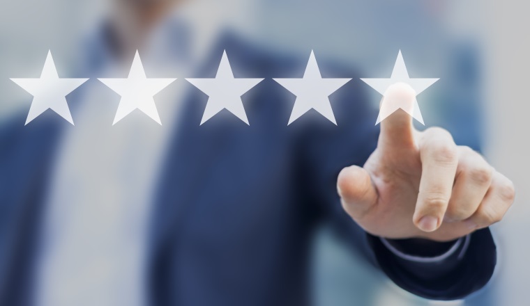 Five stars (5) rating with a businessman touching screen, concept about positive customer feedback and review, excellent performance