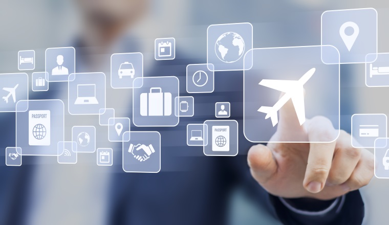 Business trip concept with a businessman touching a button on a screen with icons about travel planning, transportation, hotel, flight and passport